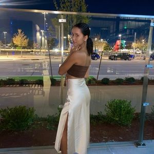 satin feel midi skirt with a slit. Not satin, it is polyester